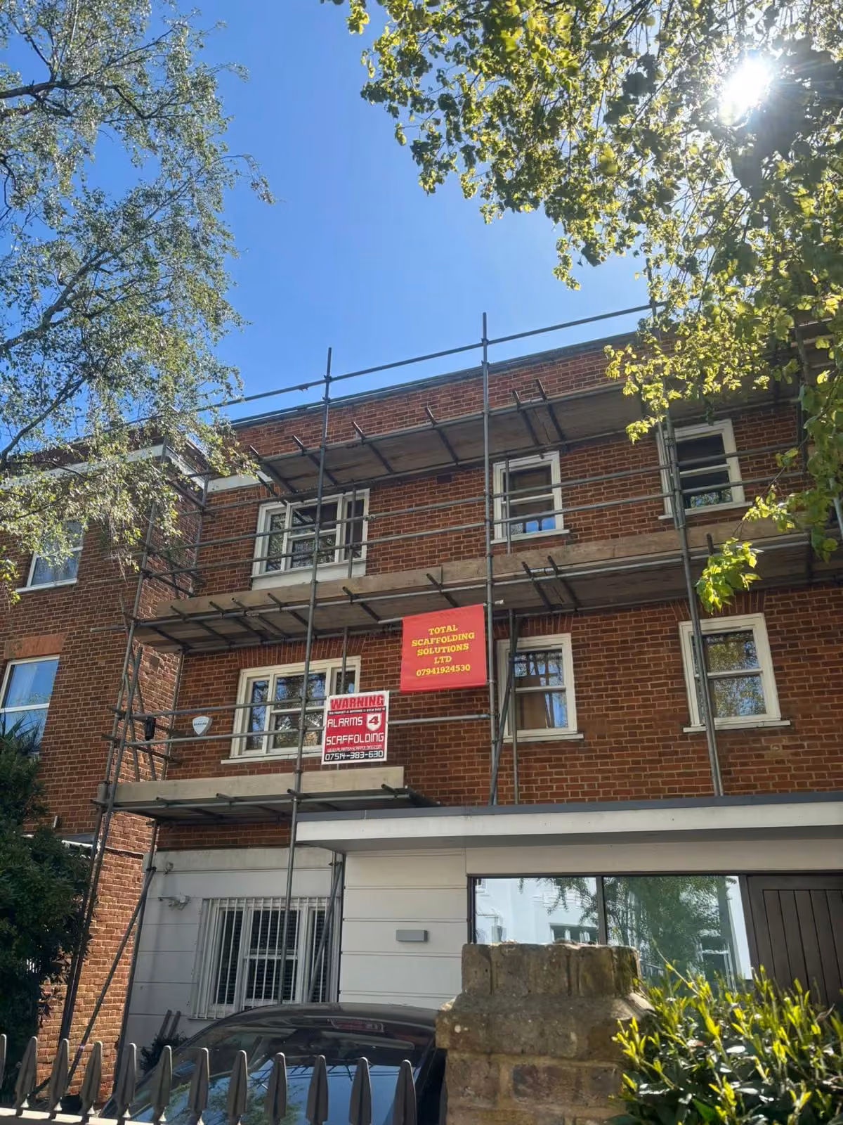 Scaffolding with ladder access on a three-storey block of flats